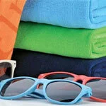 Outdoor and leisure promotional products that include towels and sunglasses