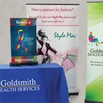 Trade show promotional products that include table top displays, table throws and retractable banners