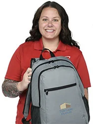 4imprint employee Chandler holding the 4imprint 15 inch Laptop Backpack