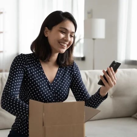 Woman getting a package while facetiming