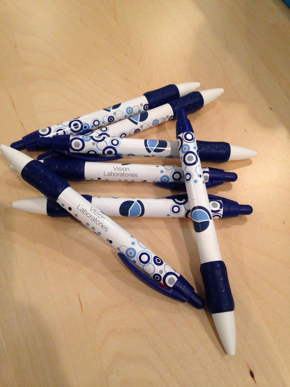 a group of pens on a table