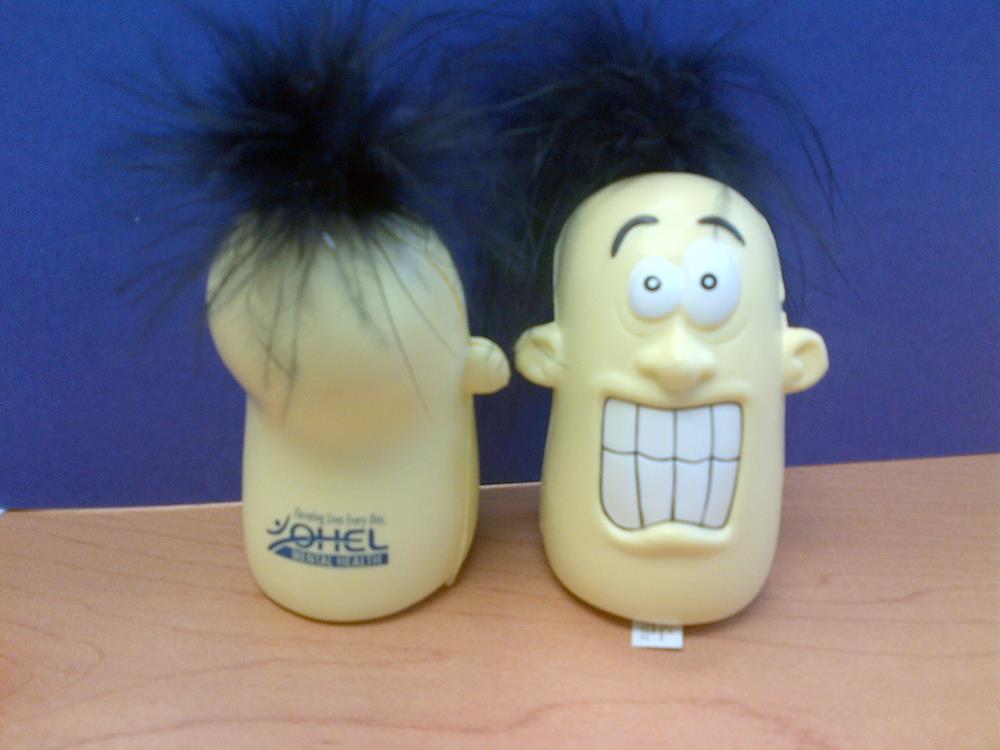 a toy head with a face and a hair on top of it