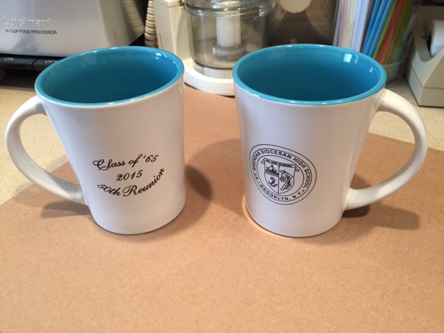 two white and blue coffee mugs