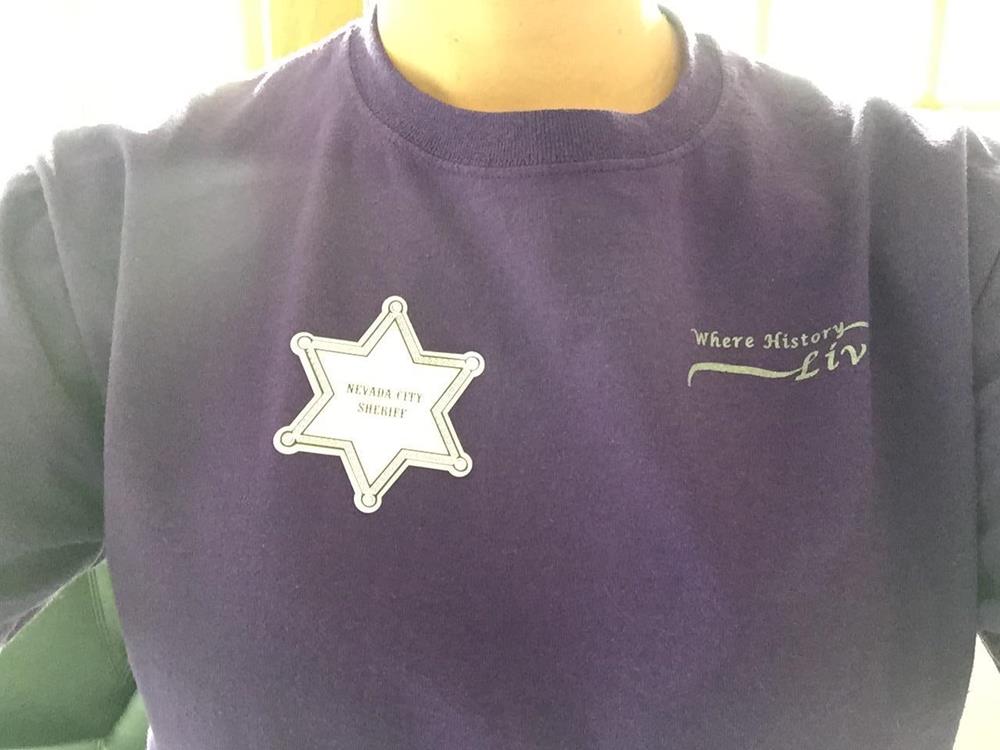 a person wearing a purple shirt with a star on it
