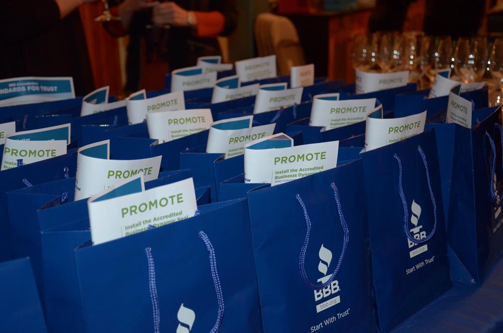 Customer photo from Breezy of our Gloss Eurotote - 9-3/4" x 7-3/4", a group of blue bags with white paper on them