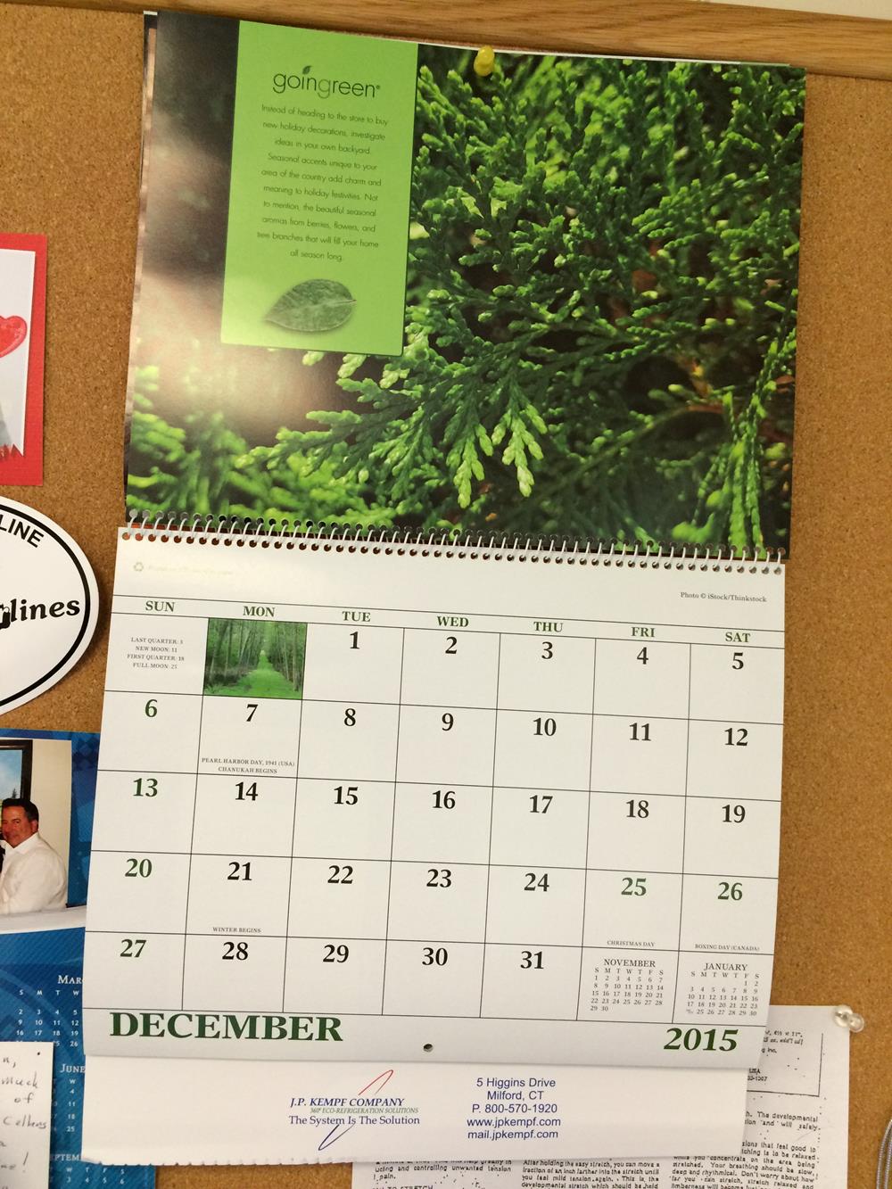 a calendar on a cork board