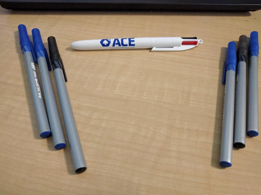 a group of pens on a table