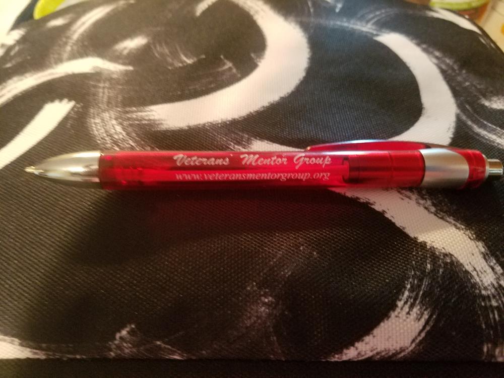 a red pen on a black and white cloth