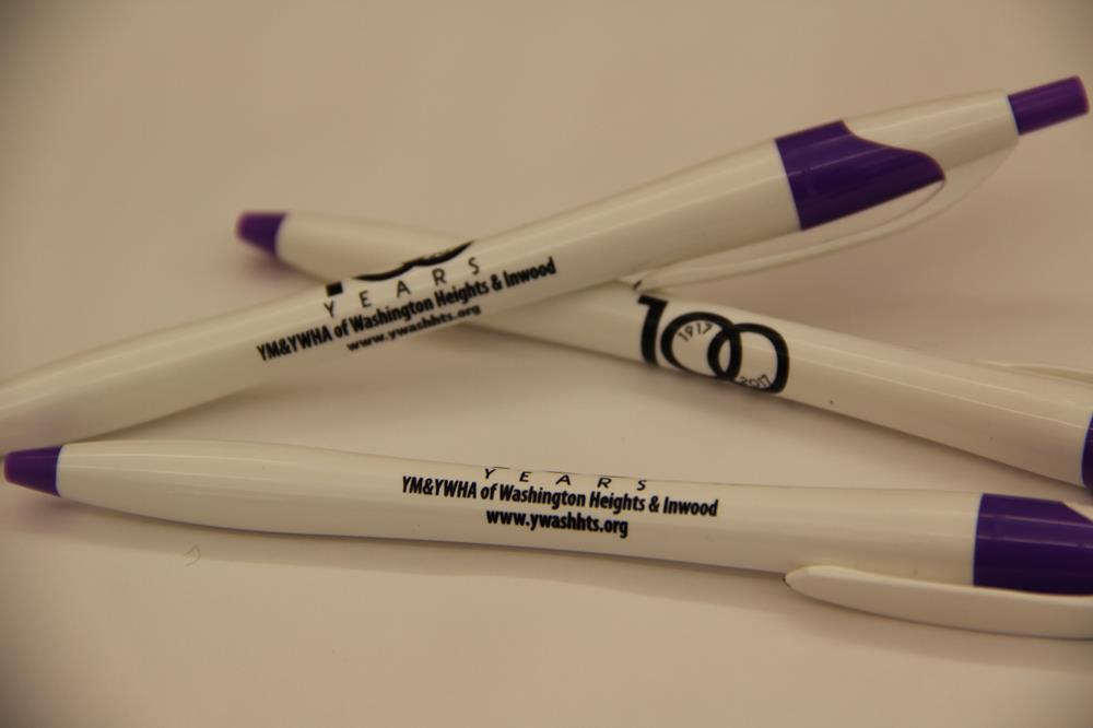 a group of white and purple pens