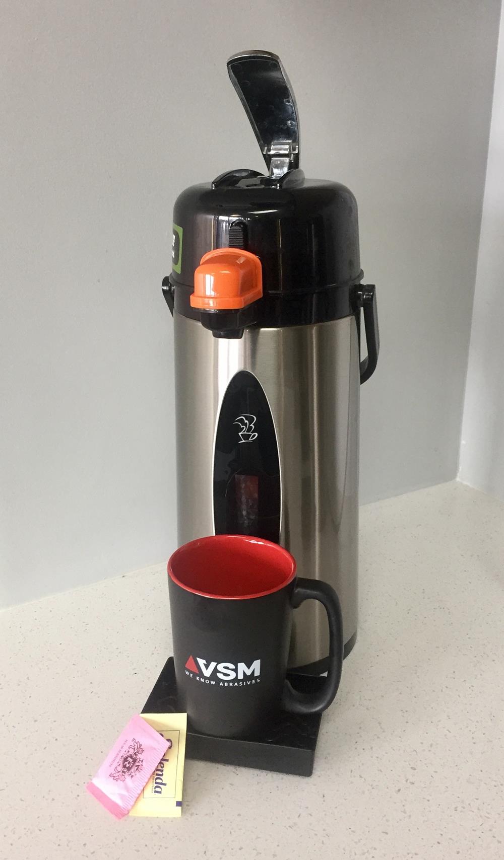 Customer photo from Rachel of our Elon Coffee Mug - 13 oz., a coffee maker and a mug