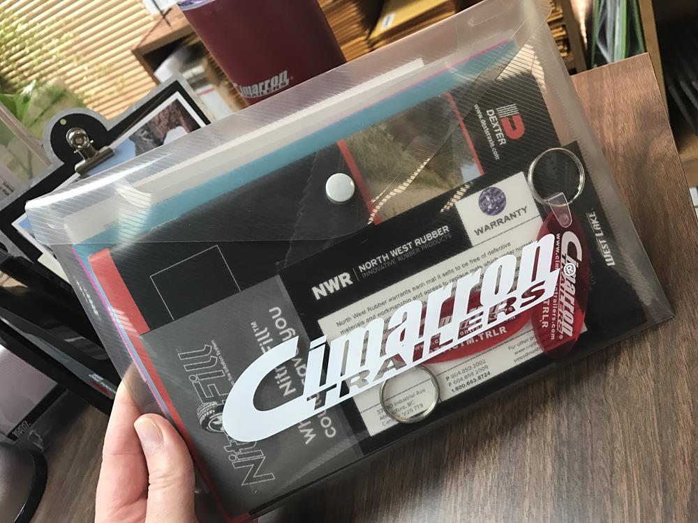 Customer photo from Heather of our Document Envelope with Snap Closure - Translucent - 7" x 9-3/4", a hand holding a plastic bag with a white label