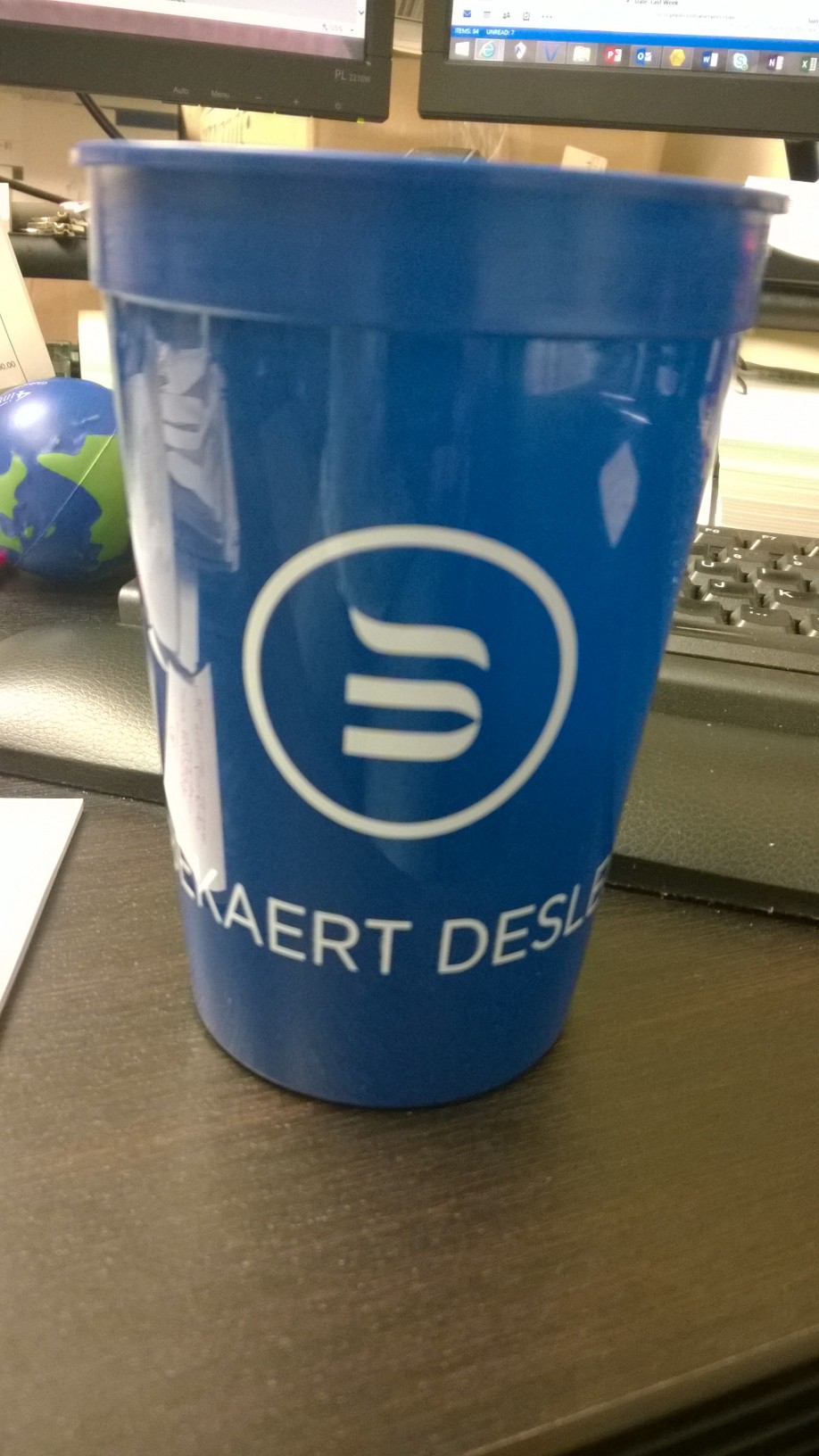a blue cup with a white logo on it