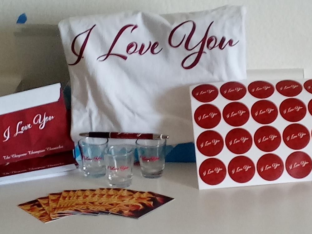 Customer photo from Shanay of our Shot Glass - 1.5 oz. Tapered, a table with a pillow and glasses and a pen