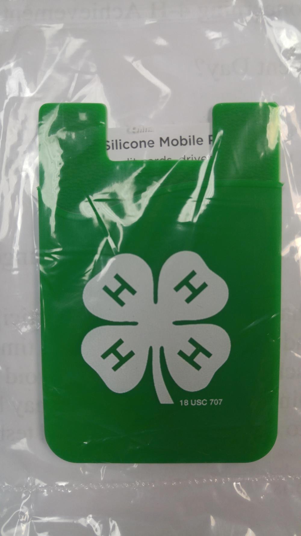 a green plastic bag with a four leaf clover on it