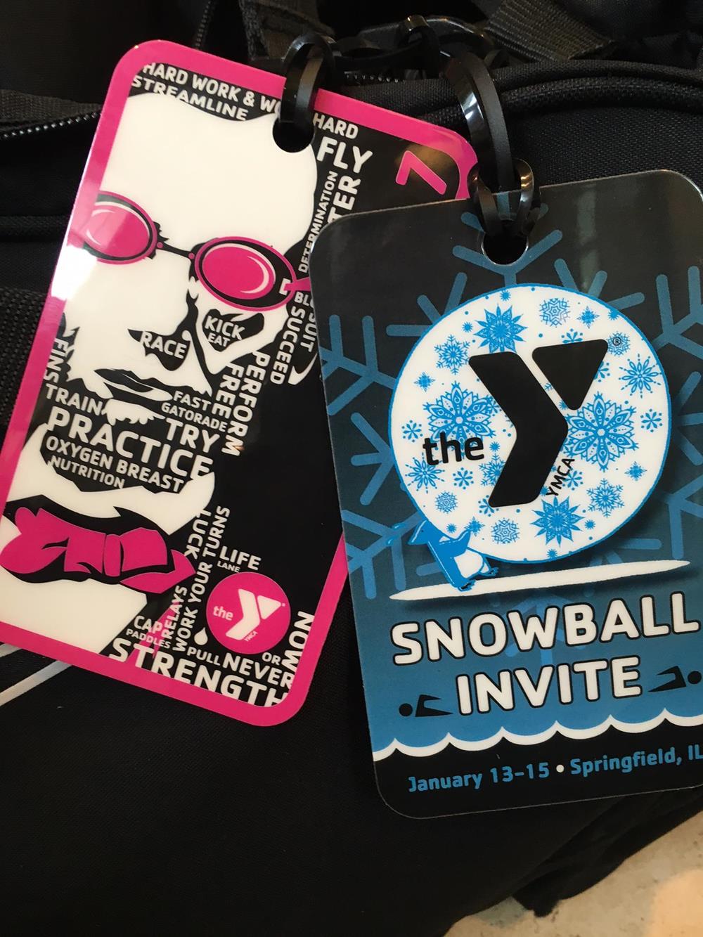 Customer photo from Erin of our Rectangle POLYspectrum Bag Tag - 3" x 5" - Opaque, a group of tags on a black surface
