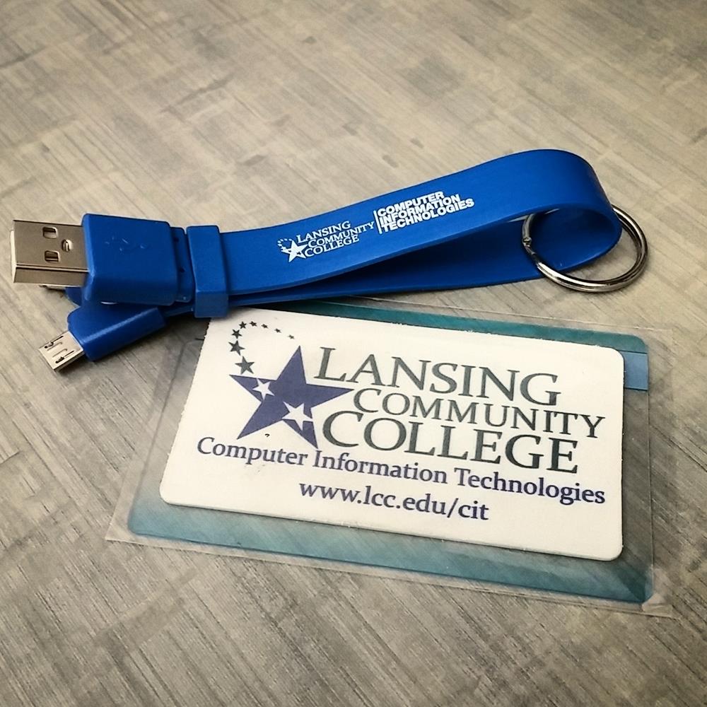 Customer photo from Lindsay of our MicroBuff - 1-11/16" x 3", a blue usb cable with a name tag