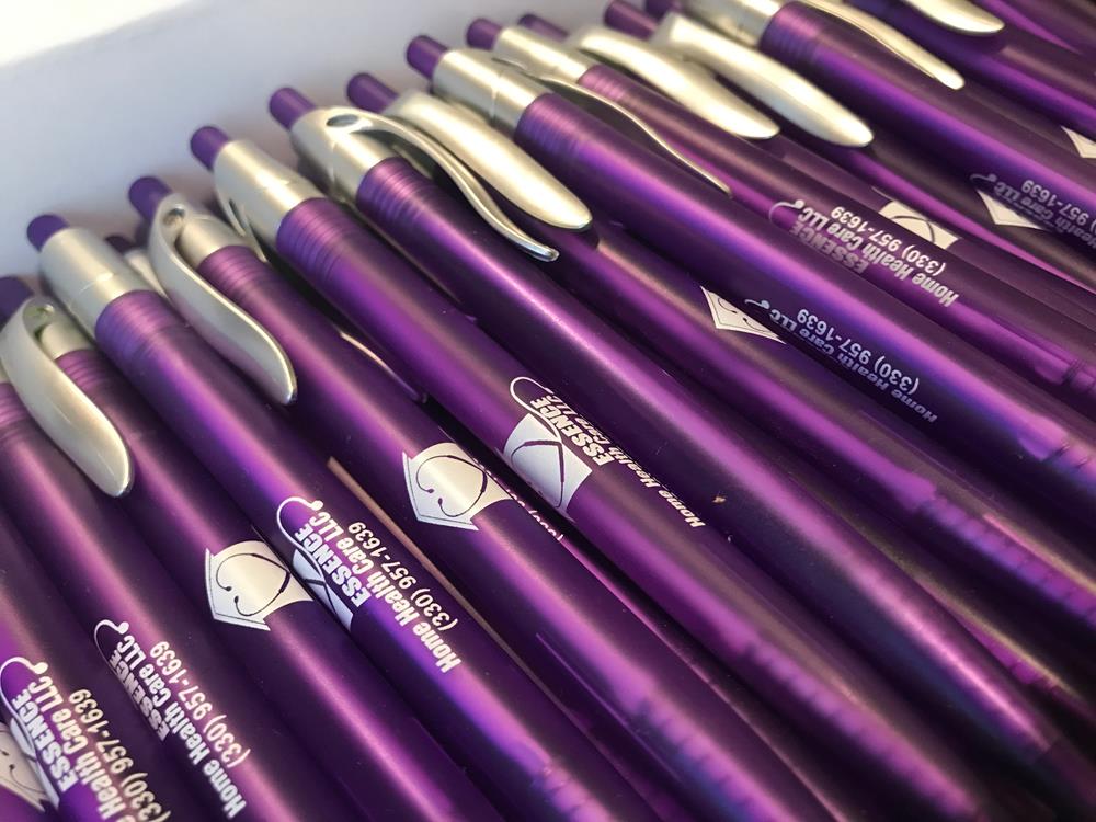 a group of purple pens
