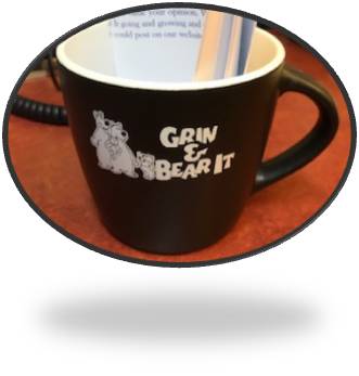Customer photo from Bobbie of our Riviera Ceramic Mug - 10 oz., a black coffee mug with white writing on it