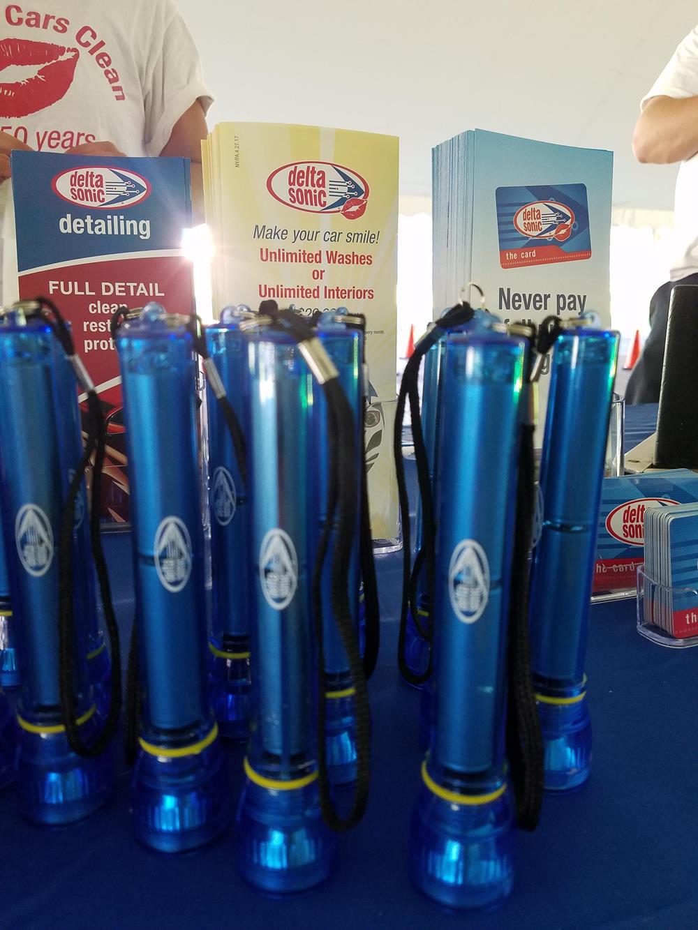 Customer photo from Christina of our Super Bright Flashlight - Translucent - 24 hr, a group of blue flashlights on a table