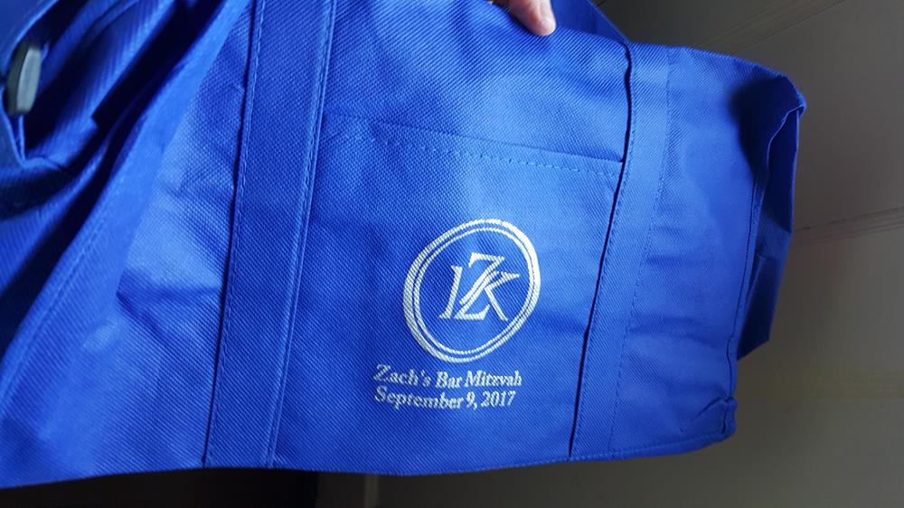 a blue bag with a white logo