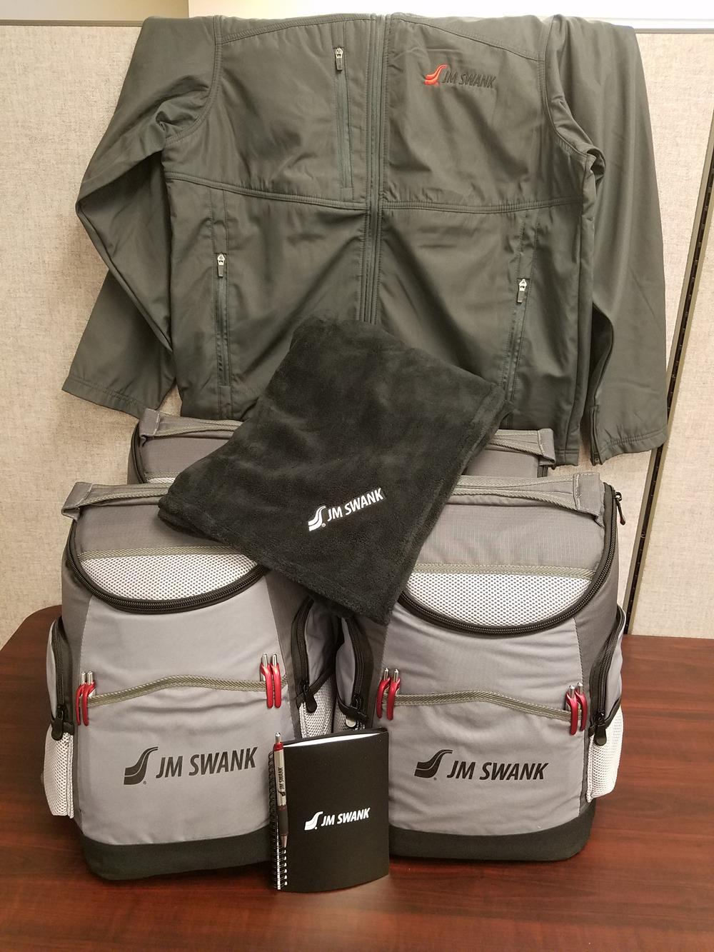 Customer photo from Jennifer of our Pocket Buddy Notebook, a jacket and backpacks on a table