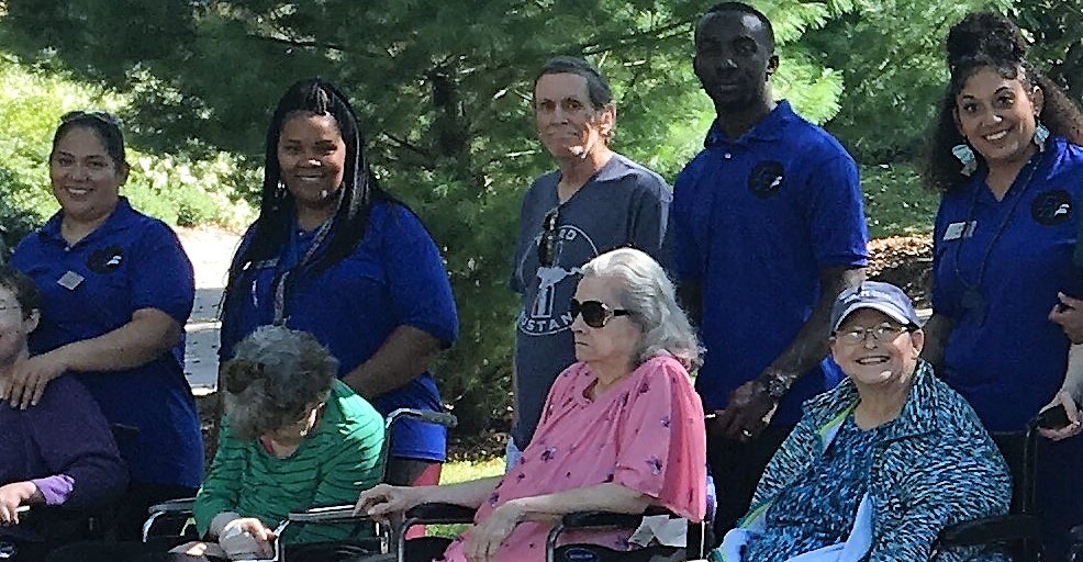 Customer photo from Cheryl of our Hanes ComfortBlend 50/50 Jersey Sport Shirt - Men's - Embroidered, a group of people standing outside