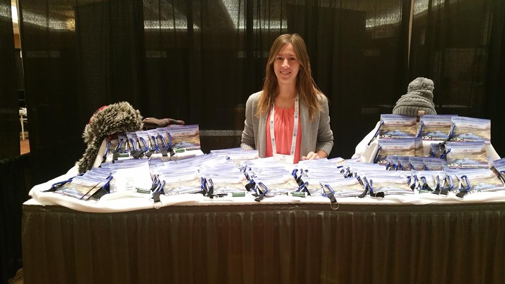 Customer photo from Sarah of our Lip Balm Tub - 100-Pieces, a woman standing behind a table with many papers