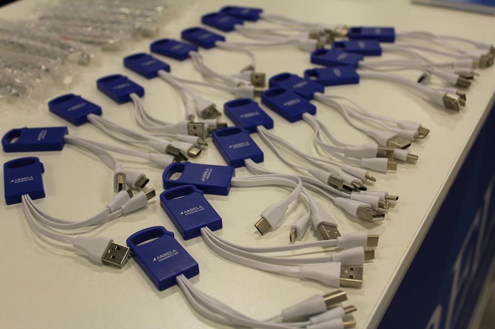 Customer photo from Andrew of our Bolt Duo Charging Cable Clip, a group of blue and white usb cables