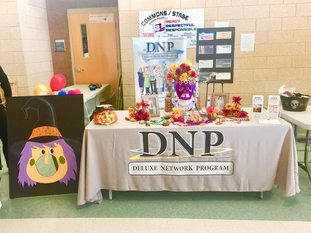 Customer photo from Doris of our Javelin Pen, a table with a table cloth and a sign
