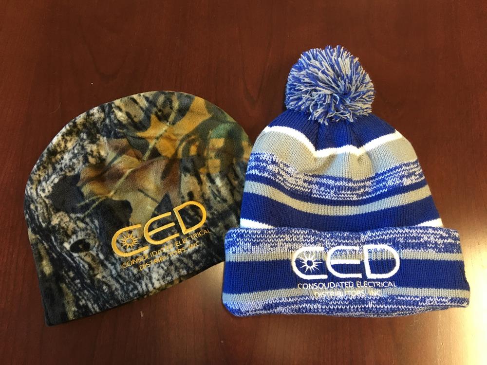 Customer photo from Nick of our Camo Fleece Beanie, two hats on a table