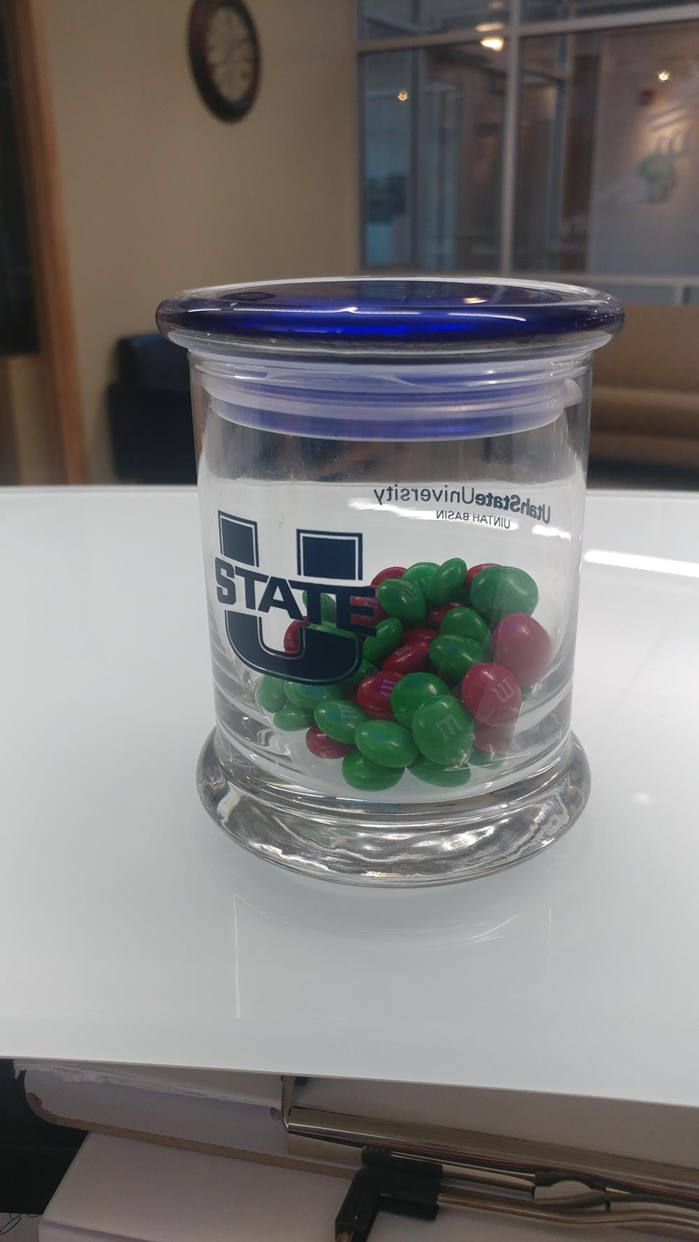 a jar of candy on a table