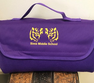 a purple bag with yellow text