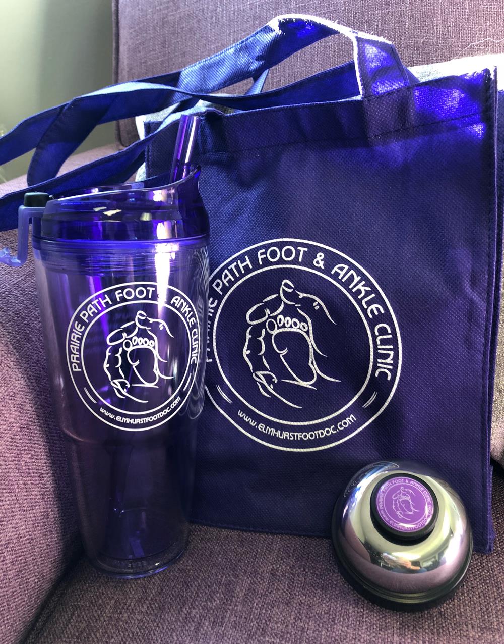 a purple cup and a blue bag