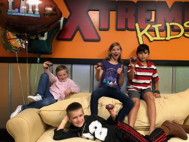 a group of kids sitting on a couch