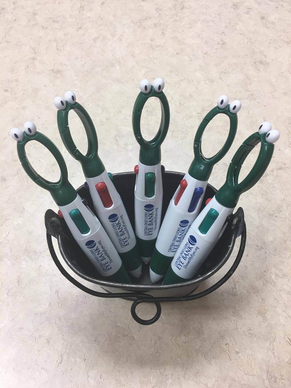 a group of pens in a basket