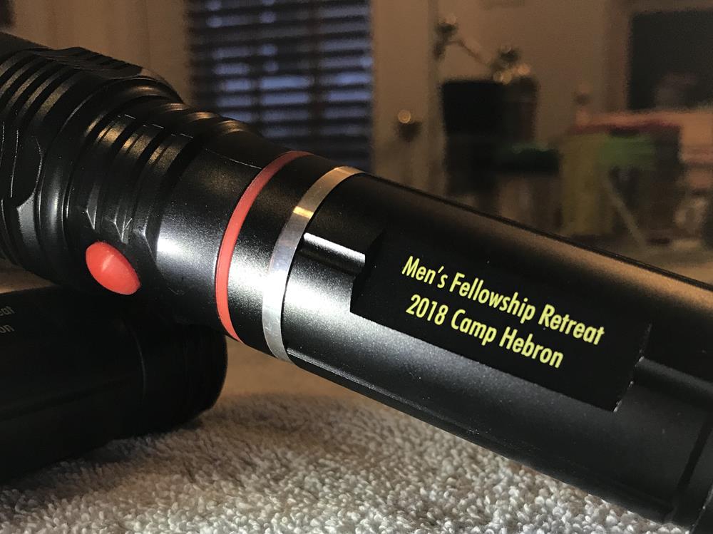 Customer photo from Donald of our Blackhawk COB Flashlight, a black flashlight with a yellow label