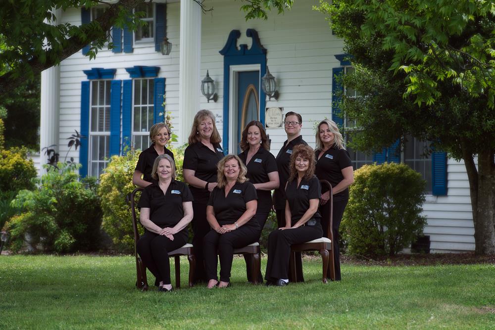 Customer photo from Heather of our Silk Touch Performance Sport Polo - Ladies' - Embroidered, a group of women in black shirts