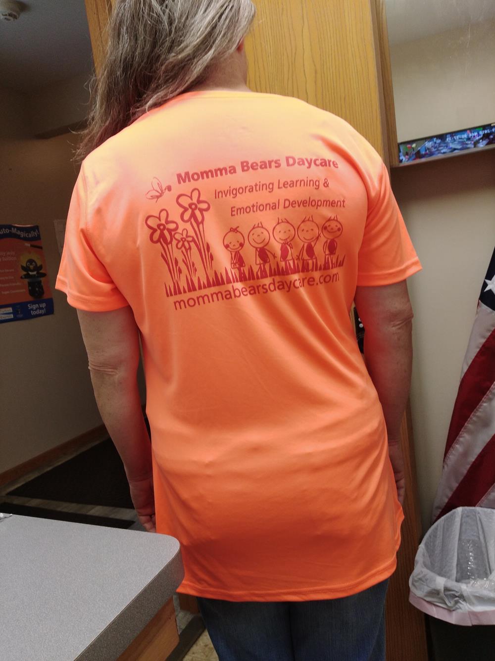 Customer photo from Margarer of our Snag Resistant Textured Performance Polo - Ladies', a woman in an orange shirt