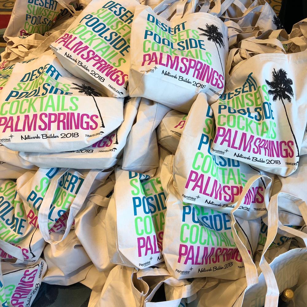 a pile of white bags with colorful text