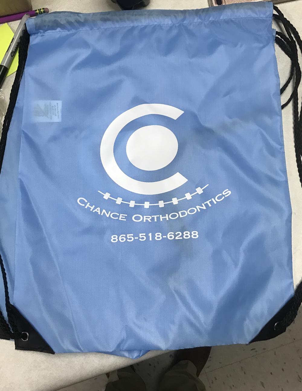 a blue bag with a white logo
