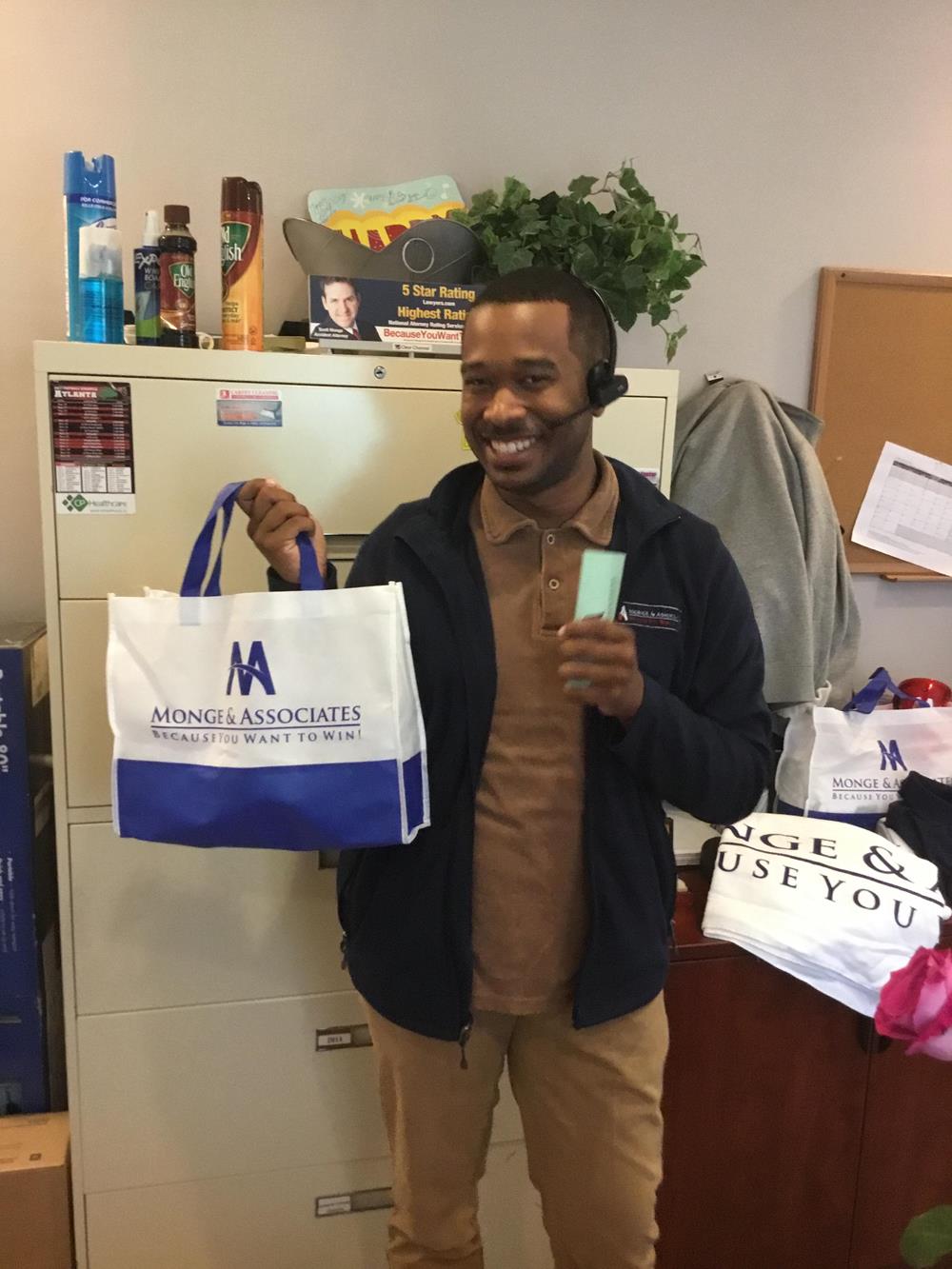 Customer photo from Lori of our Aruba Tote, a man holding a bag and smiling