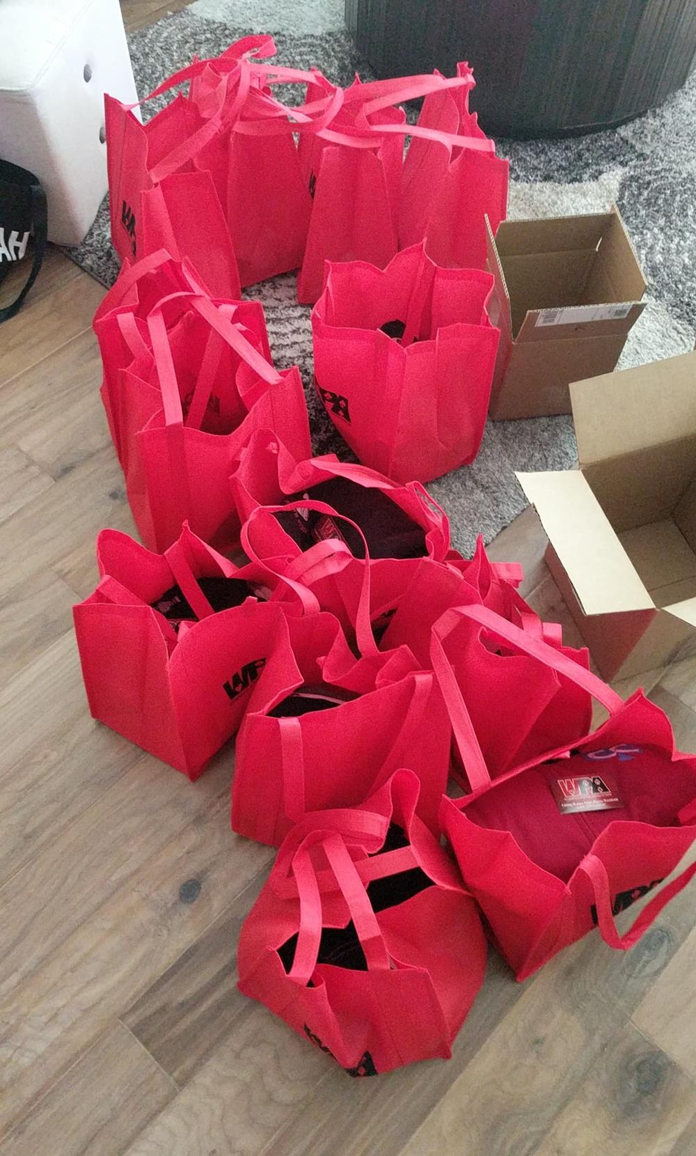 a group of red bags on a floor