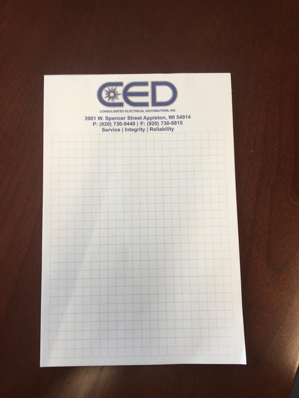 Customer photo from Nick of our Souvenir Notepad - 9" x 6" - 25 Sheet, a paper on a table