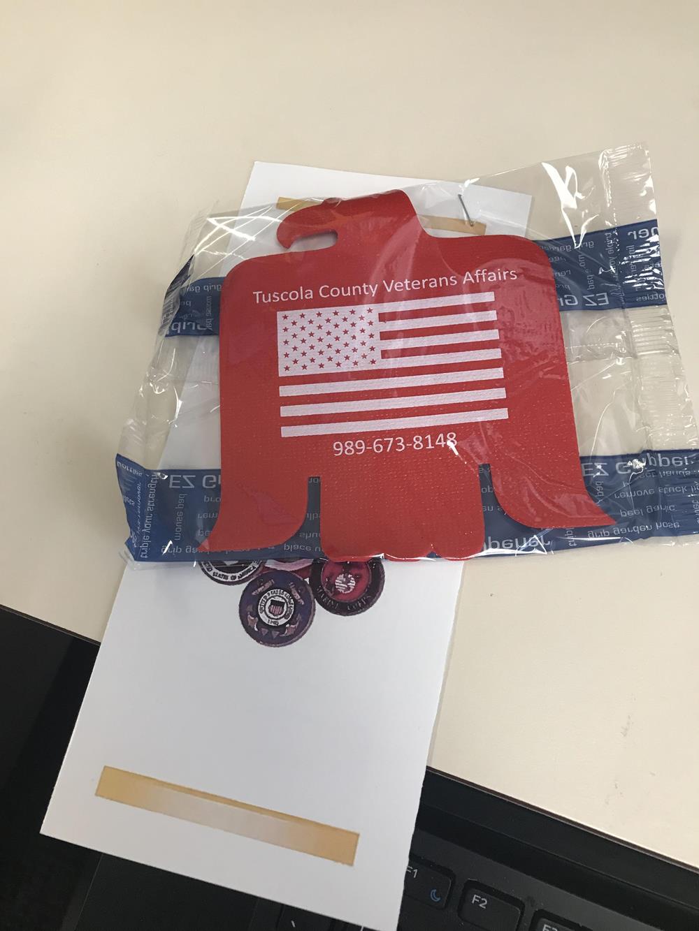 Customer photo from Rachel of our Cushioned Jar Opener - Eagle, a red and blue plastic bag with a flag on it