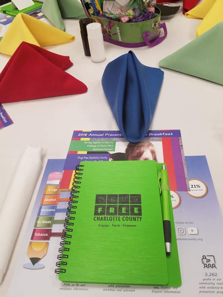 Customer photo from Diane of our Mercury Notebook with Stylus Pen, a notebook and pen on a table