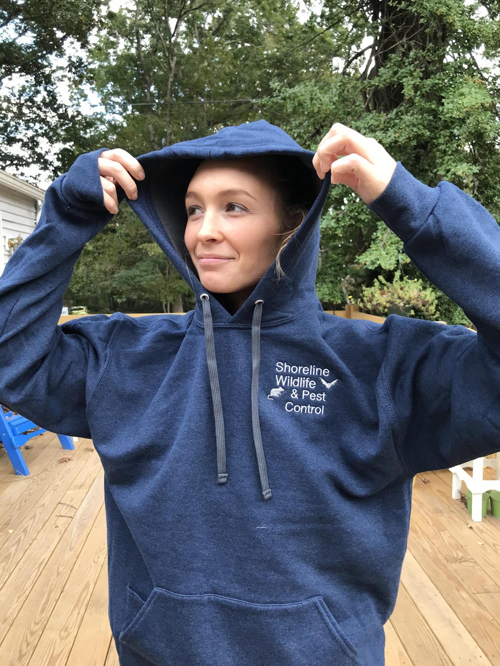 Customer photo from Dee of our Fruit of the Loom Sofspun Hooded Sweatshirt - Embroidered, a woman wearing a blue hoodie