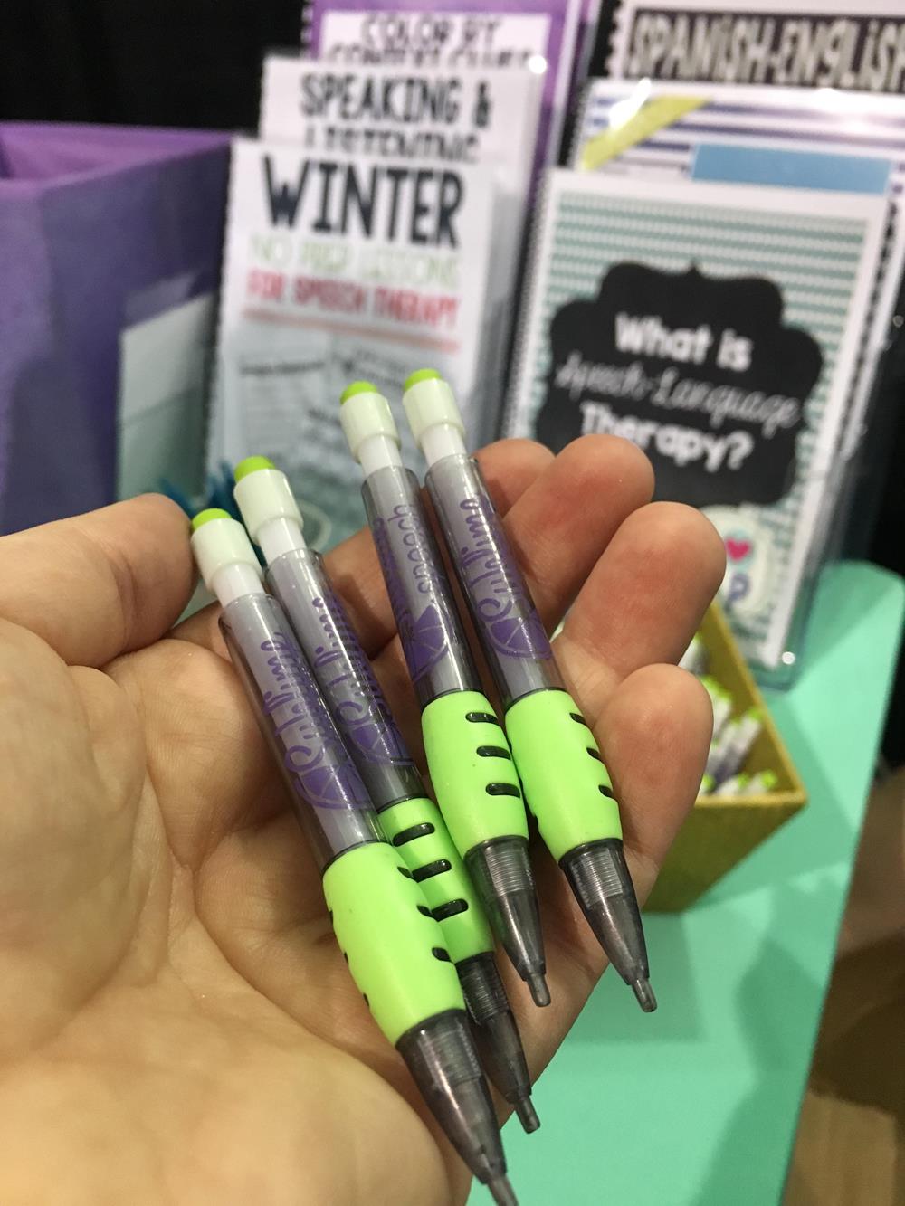 Customer photo from Danielle of our Mini Mechanical Pencil, a hand holding a group of pens
