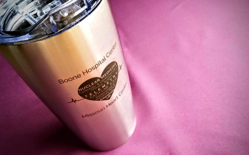Customer photo from Jennifer of our Odin Vacuum Travel Tumbler - 18 oz. - Laser Engraved, a silver metal cup with a logo on it
