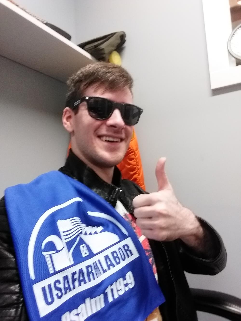 Customer photo from Alex of our Risky Business Sunglasses - Opaque, a man wearing sunglasses and a black jacket giving a thumbs up