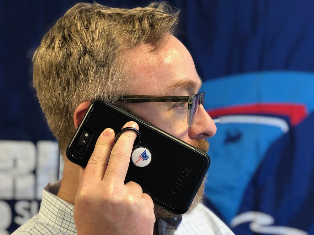 a man holding a phone to his ear